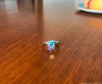 Ring on wood surface showing stone and band