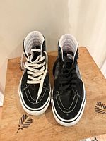 Front view showing toe boxes, mismatched laces, overall wear