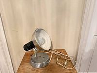 Lamp angled left showing shade, base, cord