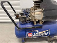 Side view showing Campbell Hausfeld logo on blue tank and pump assembly