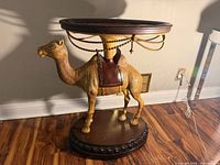 Full view of camel pedestal table front left