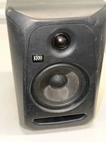 Front view showing tweeter, woofer and port