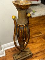 Full view of ornament showing base, body, and top dish