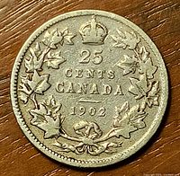 Reverse of 1902 Canada 25¢ showing maple leaf wreath and date