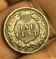 Reverse of 1907 Indian Head Cent showing ONE CENT within wreath and shield