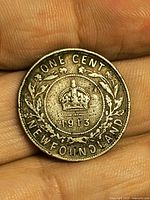 Reverse of 1913 Newfoundland one cent coin showing crown, date and legend