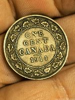 Reverse side showing ONE CENT CANADA 1914 within maple leaf wreath