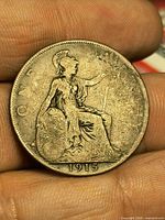 Reverse showing seated Britannia and date 1915