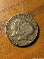 Obverse side showing dual busts and inscriptions