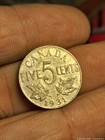 Reverse of 1931 Canadian 5 cents coin showing date and denomination