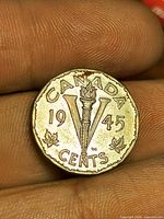 Reverse showing torch-in-V design and 1945 date