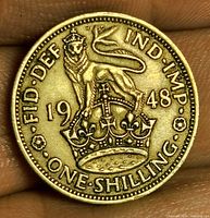 Reverse showing crowned lion over crown with legends and date 1948