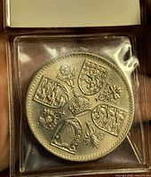 Reverse view displaying crowned shields and date 1960