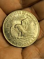 Reverse of the 1972 Eisenhower Dollar showing eagle on Moon and legends