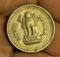 Obverse showing Ashoka Pillar three-lion emblem and legends