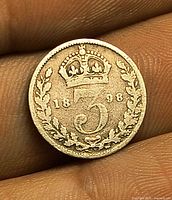 Reverse of 1898 threepence showing crown, 3, wreath, date