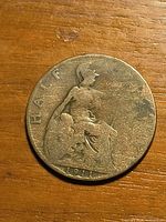 Reverse of 1911 half penny showing seated Britannia and date