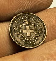 Obverse showing HELVETIA shield cross and date 1931