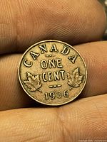 Reverse of 1936 Canadian 1-cent coin showing maple leaves and date