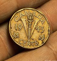 Reverse showing 1943 V design with torch and maple leaves