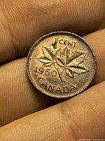 Reverse showing 1950 date, maple leaf design, denomination