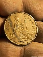 Reverse: Britannia seated with trident, inscription ONE PENNY, date 1967