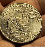 Reverse of 1972 Eisenhower dollar showing eagle on moon, denomination