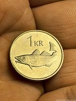 Reverse of 1 króna coin showing fish design and denomination