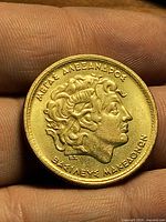 Obverse showing Alexander the Great profile and Greek inscriptions