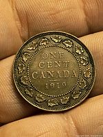 Reverse showing ONE CENT CANADA 1919 with maple leaf wreath