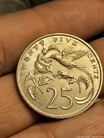 Obverse showing bird and denomination 25