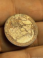Reverse displaying map of Canada, Latin motto, inscription, and 1939 shield