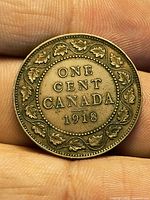 Reverse showing ONE CENT CANADA 1918 with maple-leaf wreath