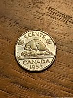 Reverse side beaver design and date 1953 visible