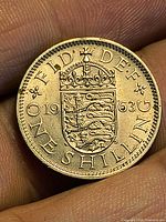 Reverse of 1963 English one shilling coin showing crowned shield and date