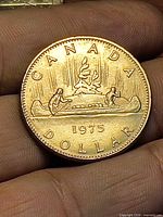 Reverse showing canoe Voyageur design and 1975 date