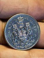 Reverse showing Canadian Coat of Arms, date 1978, denomination 50 CENTS