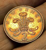 Reverse showing Prince of Wales feathers, NEW PENCE legend and 2 denomination