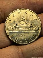 Reverse of 1972 Canadian dollar showing canoe design