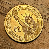 Coin reverse showing Statue of Liberty and denomination