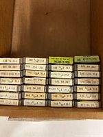 Stack of Littelfuse labelled fuse boxes in cardboard tray