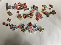 Overview of loose assorted stamps spread on surface