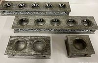 Top view showing all four grey wood tea light holders with glass cups