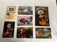Group shot of all seven promotional postcards