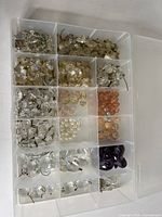 Overview of organiser showing assorted crystals and beads in compartments