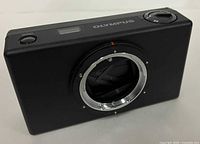 Front angled view showing metal lens mount and body detailing