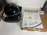 Overall view of camera assembly, installation kit, manual and box