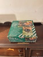 Retail box top showing grill image and branding