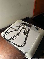 Top view of Canon PIXMA printer with power cable placed on lid