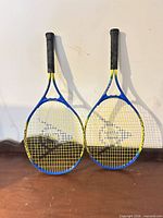 Both Dunlop oversize racquets side by side